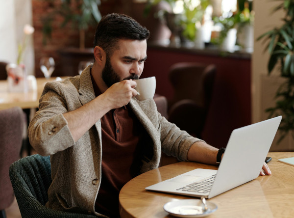 Small business owner working on laptop in Oxford office